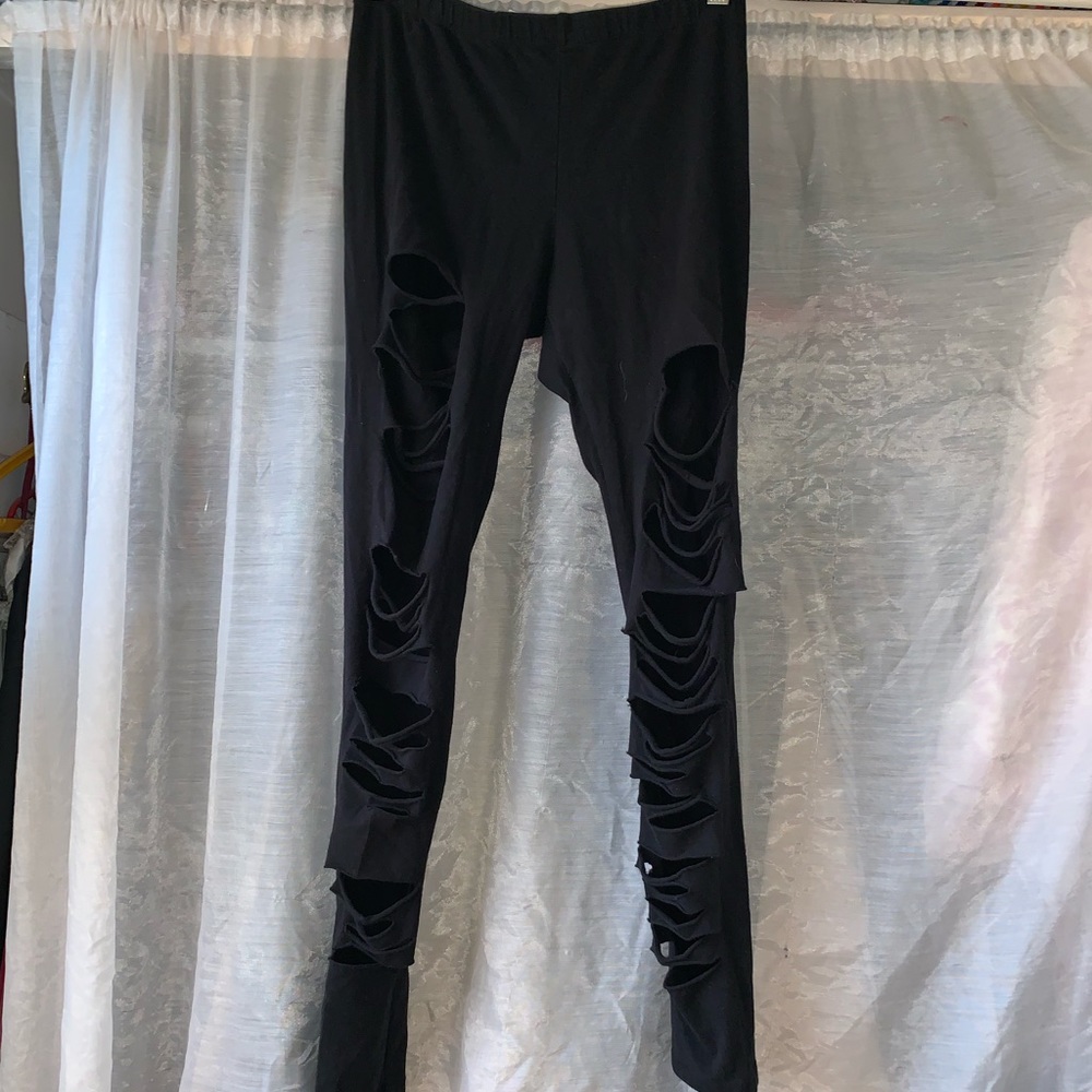 Distressed high waisted black leggings.